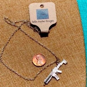 Handmade 18”  silver necklace with oversized gun pendant . NWT